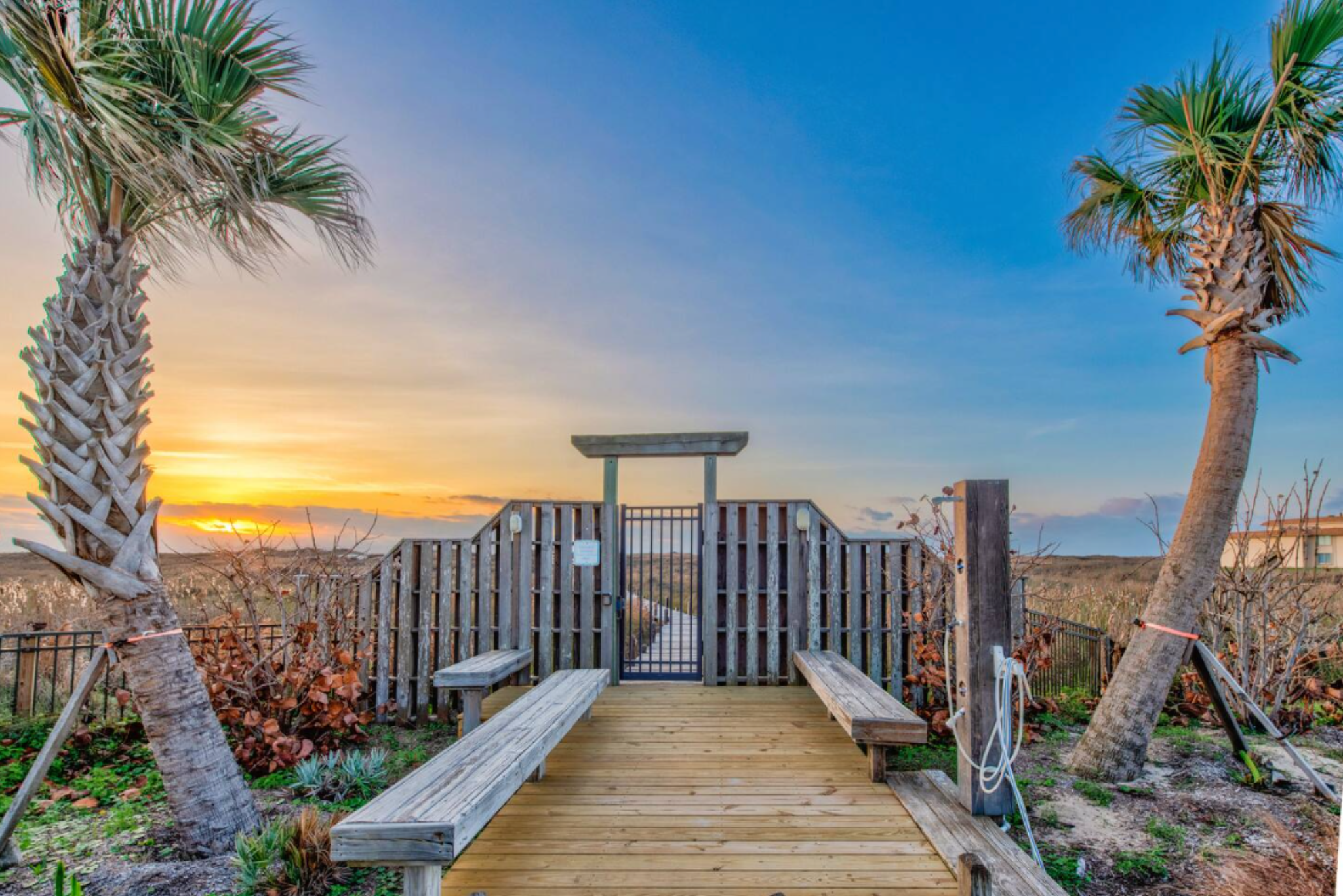 Boardwalk access to the beach at sunset